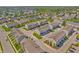 A wide aerial view of the neighborhood showcasing meticulously planned townhomes, greenery, and street layout at 3546 Brampton Ln, Westfield, IN 46074