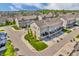 A picturesque aerial view of townhomes in a well-planned community, featuring tree-lined streets at 3546 Brampton Ln, Westfield, IN 46074