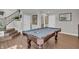 Finished basement featuring a pool table, neutral walls, and wood-look flooring at 3546 Brampton Ln, Westfield, IN 46074