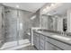 Bathroom featuring a glass enclosed shower, dual sink vanity, and a large mirror at 3546 Brampton Ln, Westfield, IN 46074