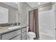 Bathroom featuring a white tub and shower, toilet, and vanity with gray countertop at 3546 Brampton Ln, Westfield, IN 46074