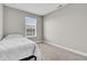 Neutral bedroom featuring a bed, window, neutral carpet, and natural light at 3546 Brampton Ln, Westfield, IN 46074