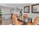Dining area features wood floors, a dark wood table, and an open view to the kitchen at 3546 Brampton Ln, Westfield, IN 46074