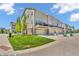 Townhomes with garages, patios, green lawns, and brick exterior at 3546 Brampton Ln, Westfield, IN 46074