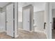 Second floor hallway featuring neutral paint, carpet, doors, and natural light at 3546 Brampton Ln, Westfield, IN 46074