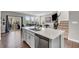 Spacious kitchen featuring a large island with a stainless steel dishwasher and quartz countertops at 3546 Brampton Ln, Westfield, IN 46074