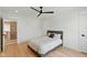 Bedroom featuring a ceiling fan, hardwood floors, and neutral-tone decor for a serene aesthetic at 4078 Besbie Way, Bargersville, IN 46106