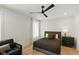 Cozy bedroom with a modern ceiling fan, neutral tones, and ample natural light at 4078 Besbie Way, Bargersville, IN 46106