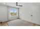 Bright bedroom boasts a ceiling fan, a neutral rug, and a large window with an expansive countryside view at 4078 Besbie Way, Bargersville, IN 46106