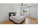 A bedroom with a queen bed with neutral bedding, and a ceiling fan for comfort at 4078 Besbie Way, Bargersville, IN 46106