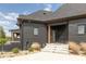 Stylish home exterior with a dark facade, complemented by well-maintained landscaping at 4078 Besbie Way, Bargersville, IN 46106