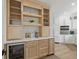 Bright kitchen featuring custom cabinets, wine fridge, and marble countertops at 4078 Besbie Way, Bargersville, IN 46106