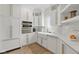 Bright kitchen with stainless steel appliances and farmhouse sink at 4078 Besbie Way, Bargersville, IN 46106