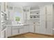 Bright kitchen featuring stainless steel appliances, farmhouse sink, and marble countertops at 4078 Besbie Way, Bargersville, IN 46106