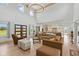 Spacious living room featuring a high ceiling, modern chandelier, and an open floor plan to the kitchen at 4078 Besbie Way, Bargersville, IN 46106