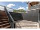 The exterior of the basement is shown, with an ornate stone floor, stairs, and black iron railing at 4078 Besbie Way, Bargersville, IN 46106
