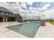 Beautiful outdoor pool with stone water feature, basketball hoop, and diving board at 4078 Besbie Way, Bargersville, IN 46106