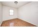 Clean and bright bedroom featuring a light wood floor, neutral walls and a window at 423 W Janet Dr, Brownsburg, IN 46112