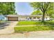 Charming single-story home featuring a well-maintained lawn and a two-car attached garage at 423 W Janet Dr, Brownsburg, IN 46112