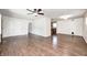 Spacious living room featuring stylish flooring, neutral paint and direct access to kitchen at 423 W Janet Dr, Brownsburg, IN 46112