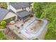 Aerial view of the backyard featuring a pool, hot tub, screened-in porch and spacious patio for outdoor enjoyment at 4232 Briarwood Dr, Indianapolis, IN 46250