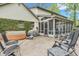 Relaxing back patio with a hot tub, a screened-in porch, and outdoor seating perfect for enjoying the fresh air at 4232 Briarwood Dr, Indianapolis, IN 46250