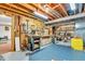 Unfinished basement with workbench and tool storage, perfect for DIY projects and hobbies at 4232 Briarwood Dr, Indianapolis, IN 46250