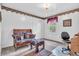 Inviting bedroom with floral accents, a desk, and a comfortable seating area at 4232 Briarwood Dr, Indianapolis, IN 46250
