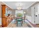 Bright dining room features a chandelier, wallpaper, hardwood floors, and a built-in hutch at 4232 Briarwood Dr, Indianapolis, IN 46250