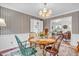 Charming dining room featuring hardwood floors, a chandelier, table with seating for four at 4232 Briarwood Dr, Indianapolis, IN 46250