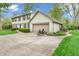 Spacious driveway leading to a two-car garage, with chairs set up for relaxation at 4232 Briarwood Dr, Indianapolis, IN 46250