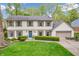 Well-maintained two-story house with green lawn, tidy landscaping, and a two-car garage at 4232 Briarwood Dr, Indianapolis, IN 46250