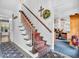 Inviting foyer with staircase and decorative accents, leading to other rooms at 4232 Briarwood Dr, Indianapolis, IN 46250