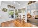 Hallway with hardwood floors, decorated transom, leading into a decorated living space at 4232 Briarwood Dr, Indianapolis, IN 46250