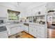 Kitchen area featuring appliances, cabinets, and a view into an adjoining living space at 4232 Briarwood Dr, Indianapolis, IN 46250
