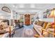 Inviting living room featuring a fireplace, shelving, and an elegant rug over carpet at 4232 Briarwood Dr, Indianapolis, IN 46250