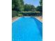 Sparkling in-ground swimming pool with ample space for relaxing and entertaining in a serene outdoor setting at 4232 Briarwood Dr, Indianapolis, IN 46250