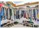 Organized walk-in closet with multiple shelves and ample storage space for clothes and shoes at 4232 Briarwood Dr, Indianapolis, IN 46250