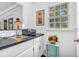 Convenient wet bar area featuring a sink, countertop space, and ample natural light at 4232 Briarwood Dr, Indianapolis, IN 46250