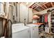 Practical laundry area equipped with washer, dryer, and storage space at 4302 Kessler Blvd N Dr, Indianapolis, IN 46220