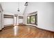 Bright living room features hardwood floors, built-in closet spaces, modern chandelier and large windows at 4302 Kessler Blvd N Dr, Indianapolis, IN 46220