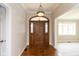 Welcoming entryway featuring hardwood floors, elegant lighting, and a decorative wooden door with sidelights at 4351 W Fox Ridge Ave, Greenwood, IN 46143