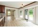 Bright kitchen with white countertops, dark wood cabinets, and access to the backyard at 4351 W Fox Ridge Ave, Greenwood, IN 46143