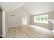 Bright and spacious living room featuring a vaulted ceiling, large windows, and neutral flooring at 4351 W Fox Ridge Ave, Greenwood, IN 46143