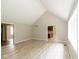 Spacious living room with a vaulted ceiling, neutral flooring, and views into the kitchen at 4351 W Fox Ridge Ave, Greenwood, IN 46143