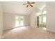 Spacious primary bedroom with a vaulted ceiling, fan, and an en-suite bathroom at 4351 W Fox Ridge Ave, Greenwood, IN 46143