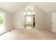 Large primary bedroom featuring a cathedral ceiling and doorway to the bath at 4351 W Fox Ridge Ave, Greenwood, IN 46143