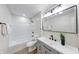 Bathroom featuring updated vanity and fixtures, as well as a shower/tub combo at 444 Buffalo Dr, Indianapolis, IN 46217