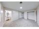 Spacious bedroom with carpet flooring and walk in closets next to the ensuite bath at 444 Buffalo Dr, Indianapolis, IN 46217