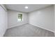 Bedroom featuring carpet flooring and a window, as well as fresh neutral paint at 444 Buffalo Dr, Indianapolis, IN 46217